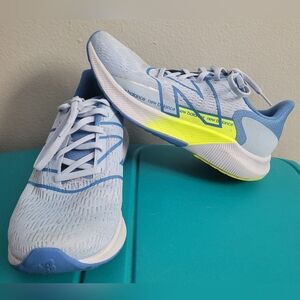 New Balance Women's Light Blue Running Shoes with Neon Yellow Accent